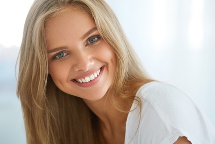 Beautiful Woman Smiling. Portrait Of Attractive Happy Healthy Girl With Perfect Smile, White Teeth, Blonde Hair And Fresh Face Smiling Indoors. Beauty And Health Concept. High Resolution Image